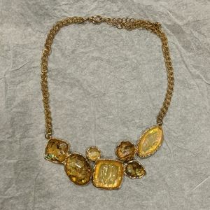 Metal necklace with amber tones